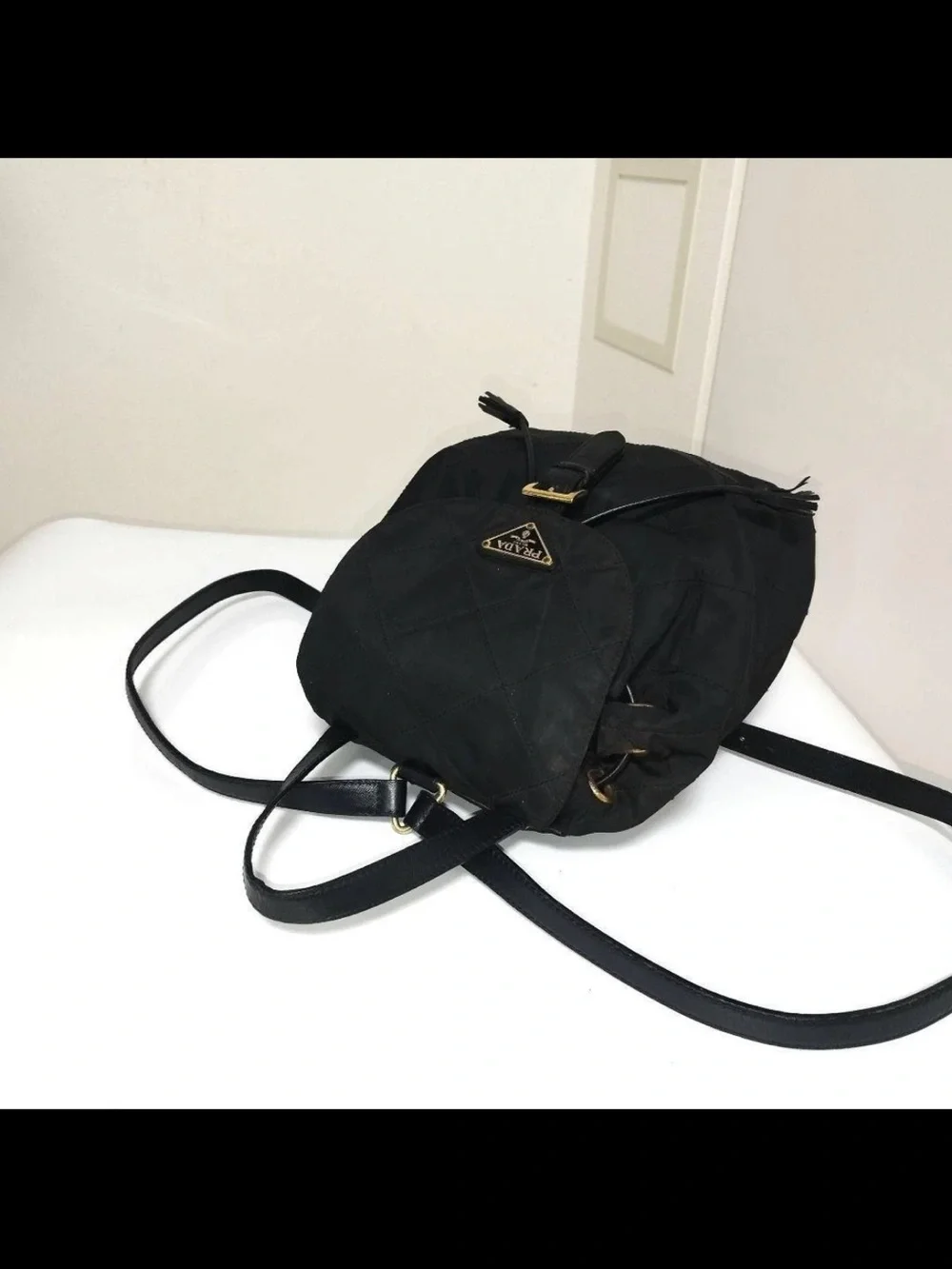 Prada Black Quilted Nylon Drawstring Backpack with Gold Hardware